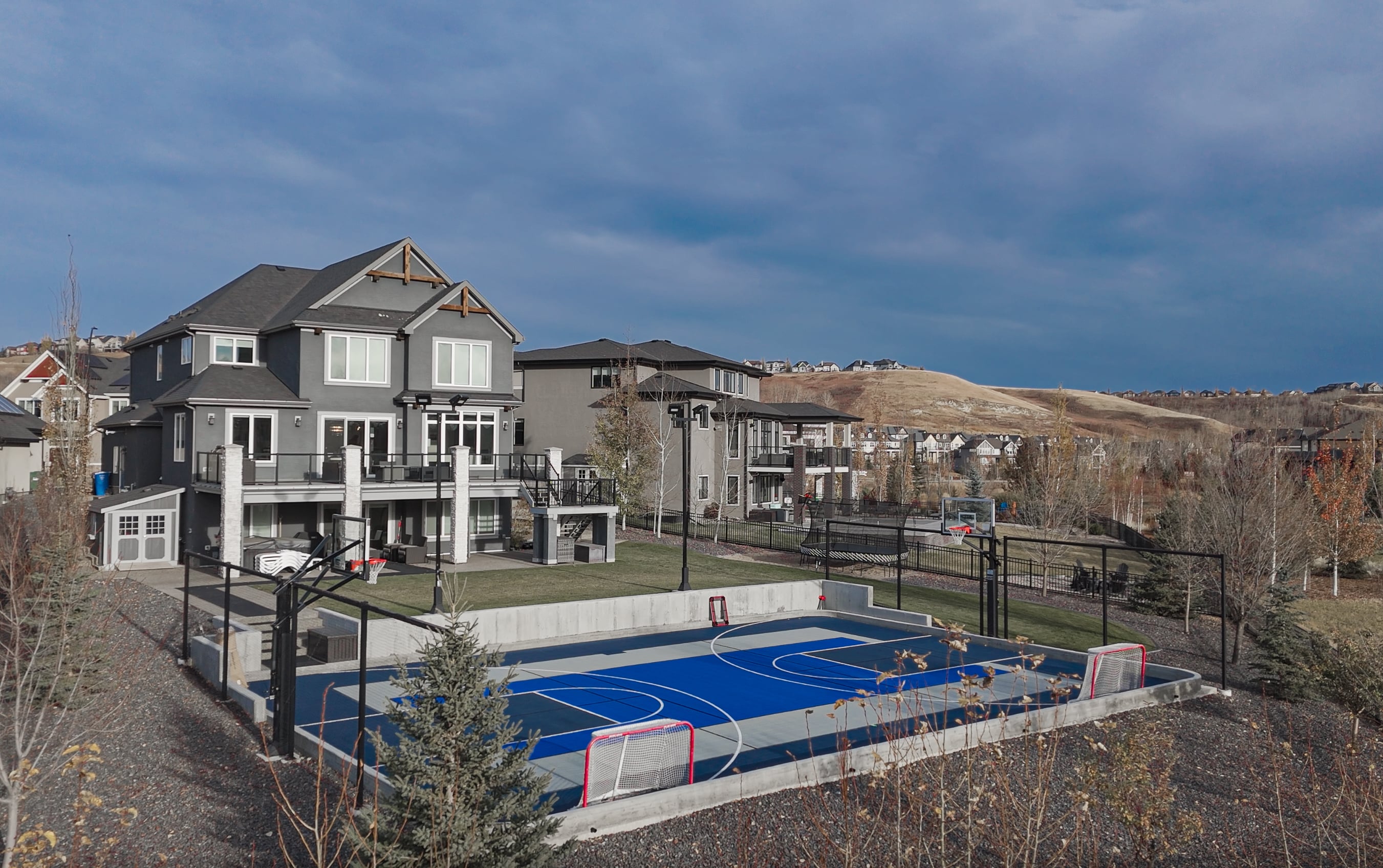 Custom backyard sport court in Calgary by Kinsmen Consulting